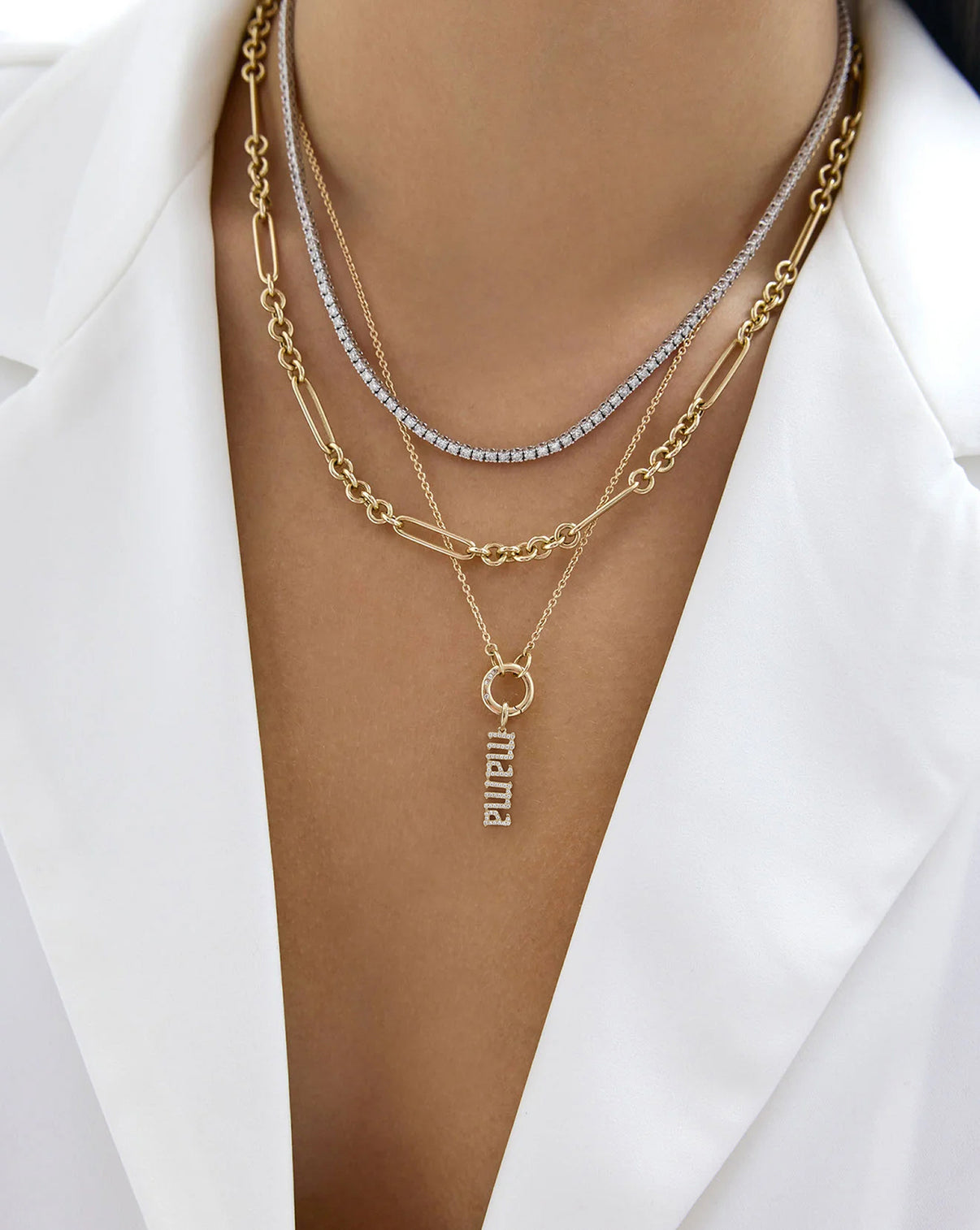 Diamond Mama Pendant styled on a clique clasp necklace layered with other necklaces