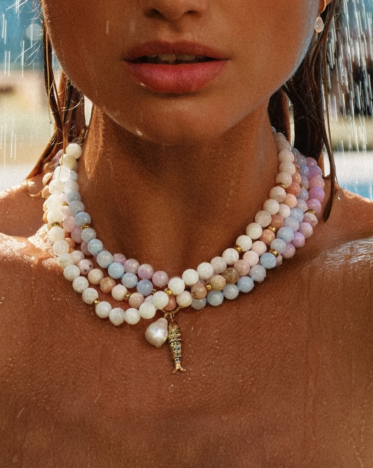 Lucky Catch Pendant worn on necklace by model along with some of our other summer collection styles.