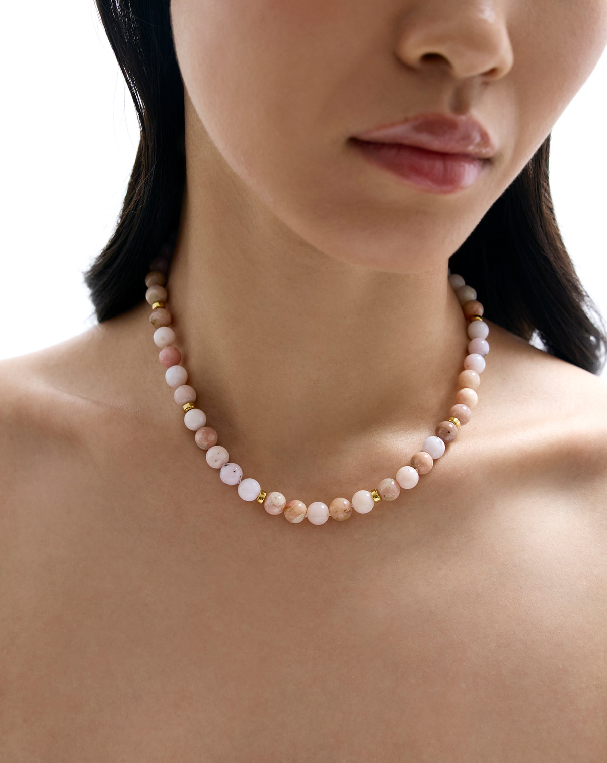 Close up of model wearing our Pink Paloma Necklace