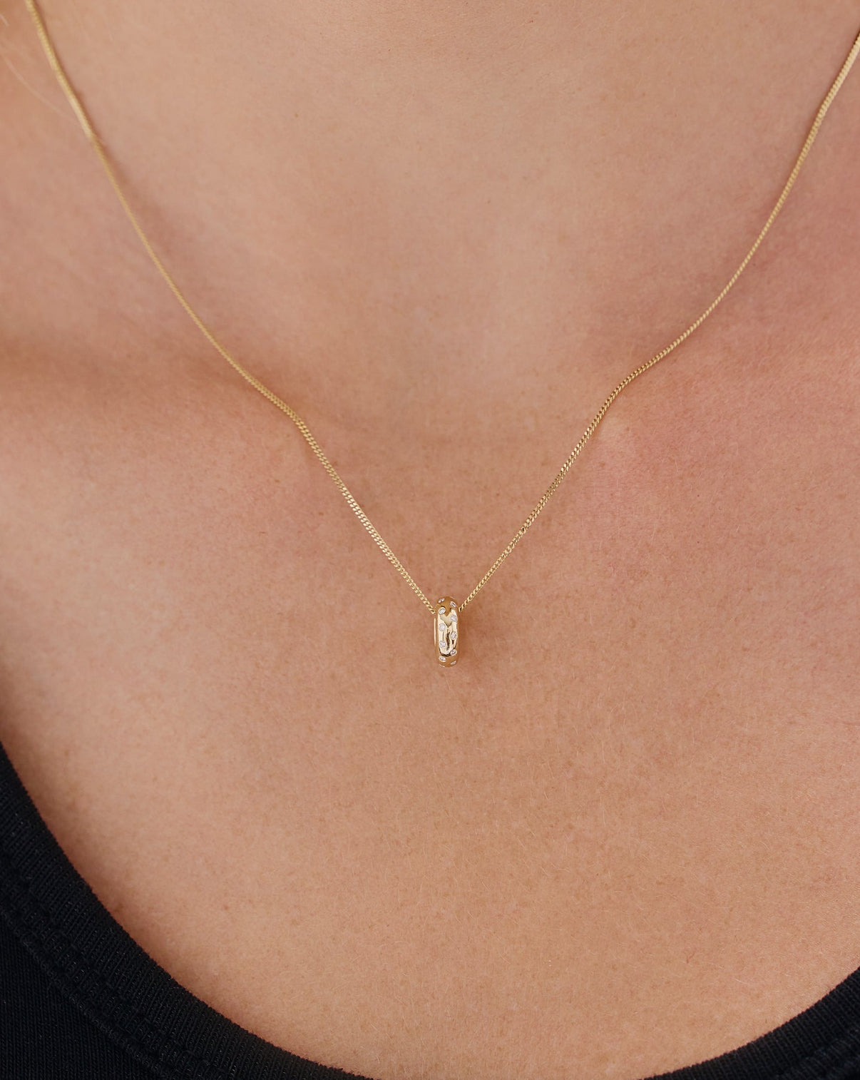 Detail shot of Scattered Diamond Bead Charm highlighting the precision-set diamonds within the gold beaded framework
