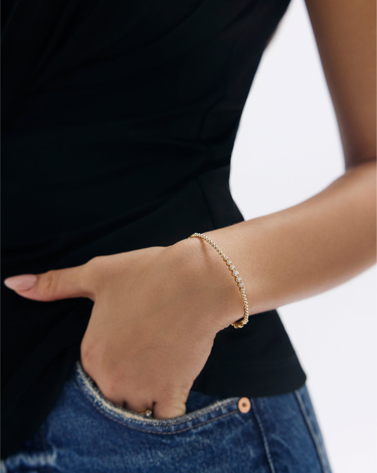 Close-up view of Ball Diamond Cluster Bangle showing diamond clusters and gold ball details