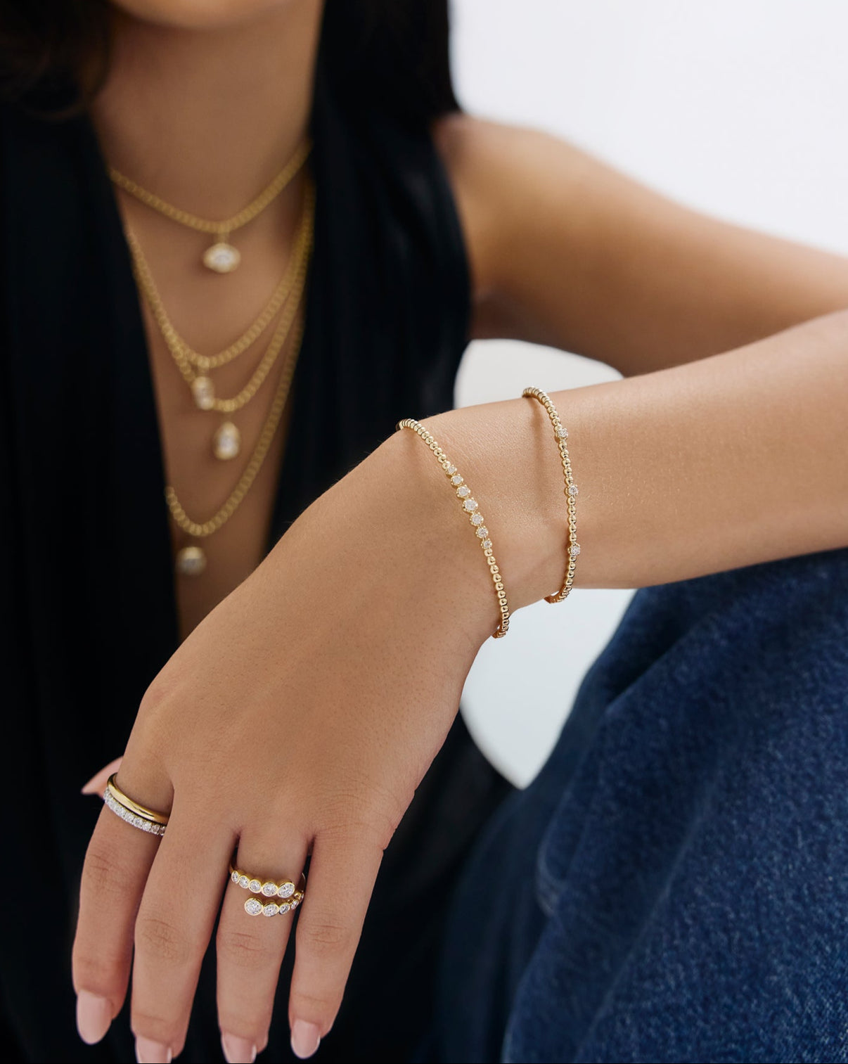 Model wearing 14k gold ball diamond bangle showcasing its sophisticated style