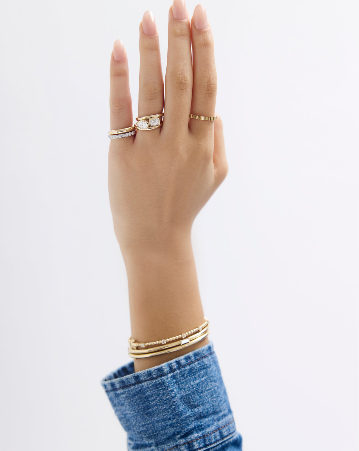 Lifestyle shot of oval bezel ring worn on hand showcasing elegant everyday wearability and comfortable fit