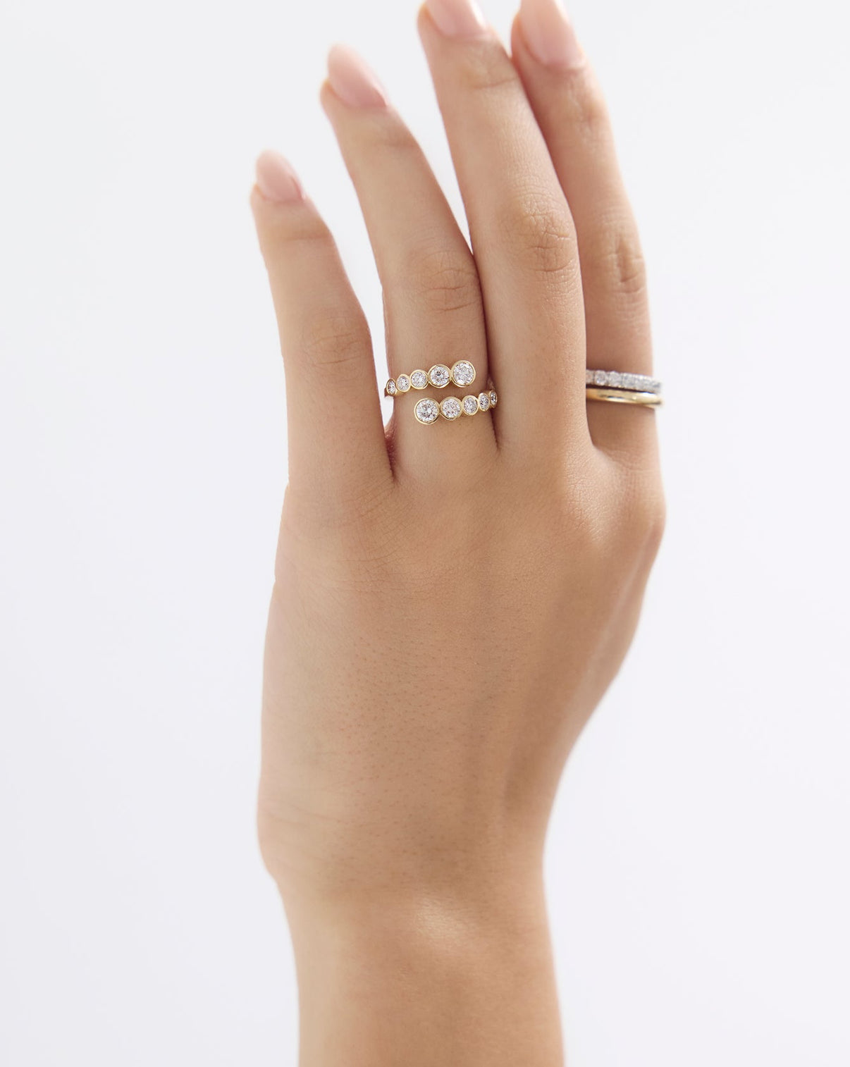 Bezel wrap ring side angle showing diamond placement and band width