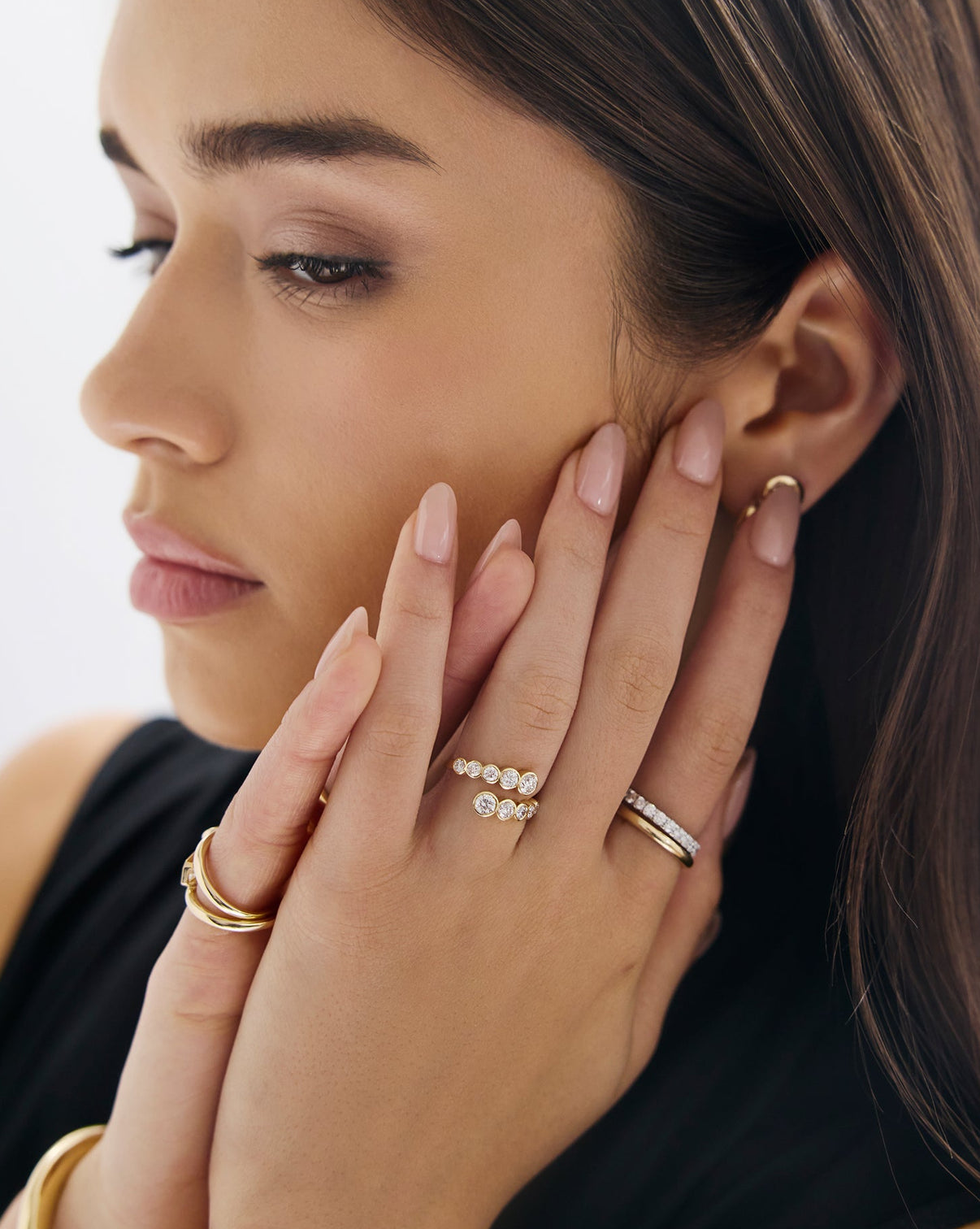 Close-up of bezel-set lab diamonds in 14k gold setting