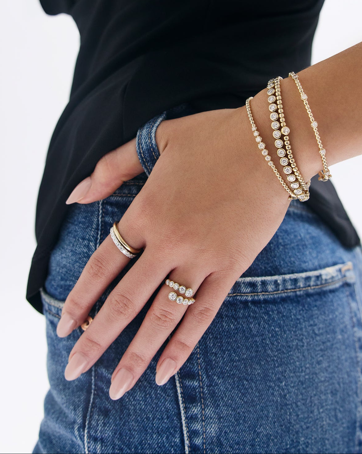 Bezel wrap ring modeled on hand showing fit and sparkle