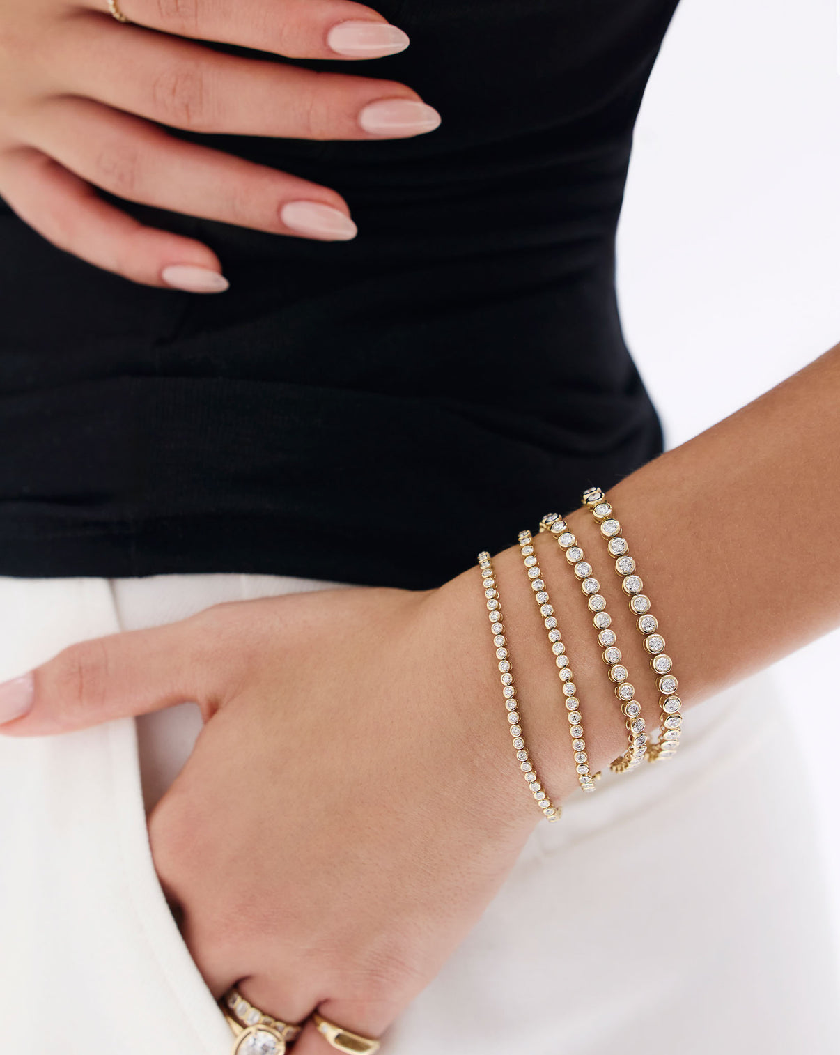 Bezel Diamond Tennis Bracelet worn on model's wrist showcasing elegant bezel-set diamond design global