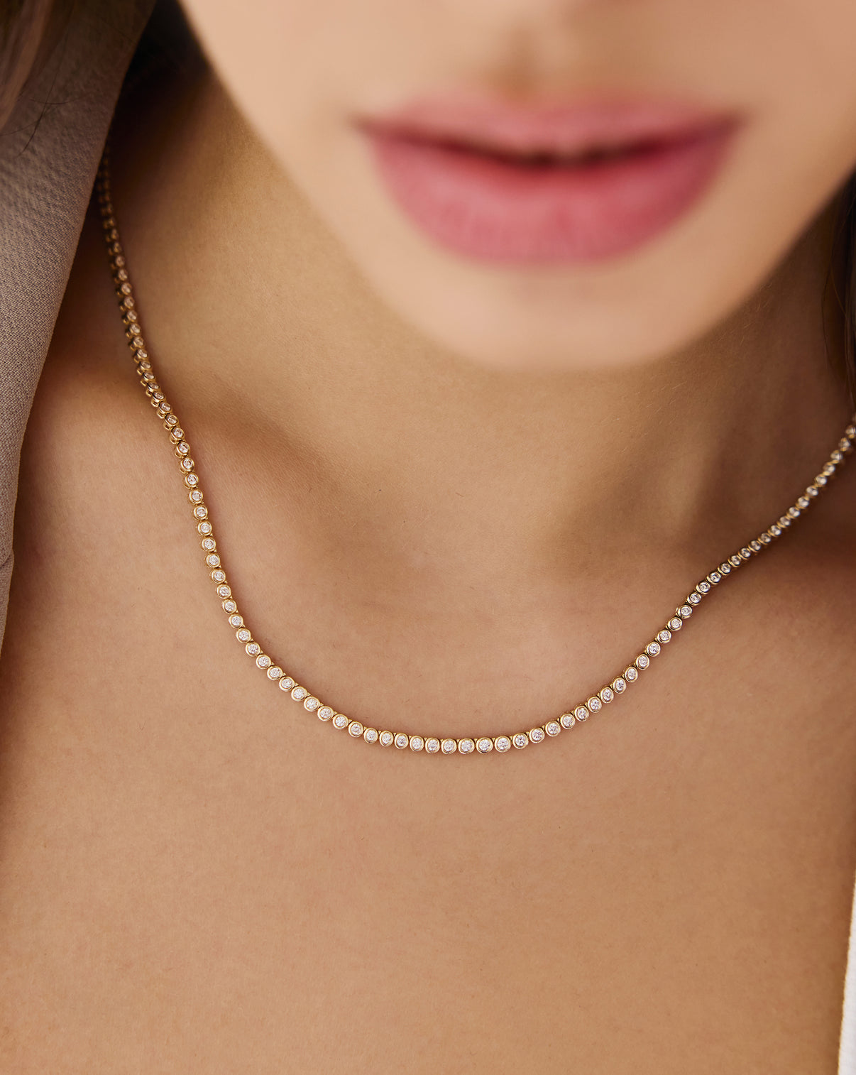 Close-up detail of Bezel Mini Diamond Tennis Necklace featuring individual bezel-set diamonds connected in elegant chain formation global