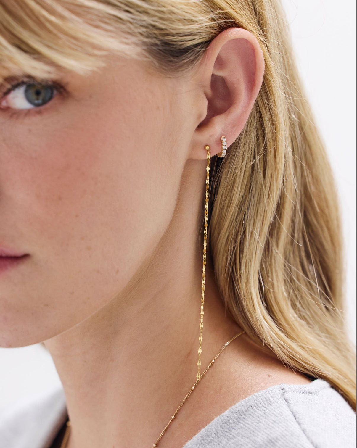 Chain Dusters earrings by Ring Concierge - detailed view of gold chain drop earrings showing texture and finish