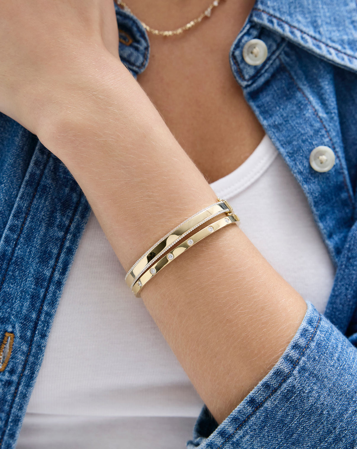 Model styling Ring Concierge Diamond Border Bangle - luxury gold and diamond bangle worn on wrist