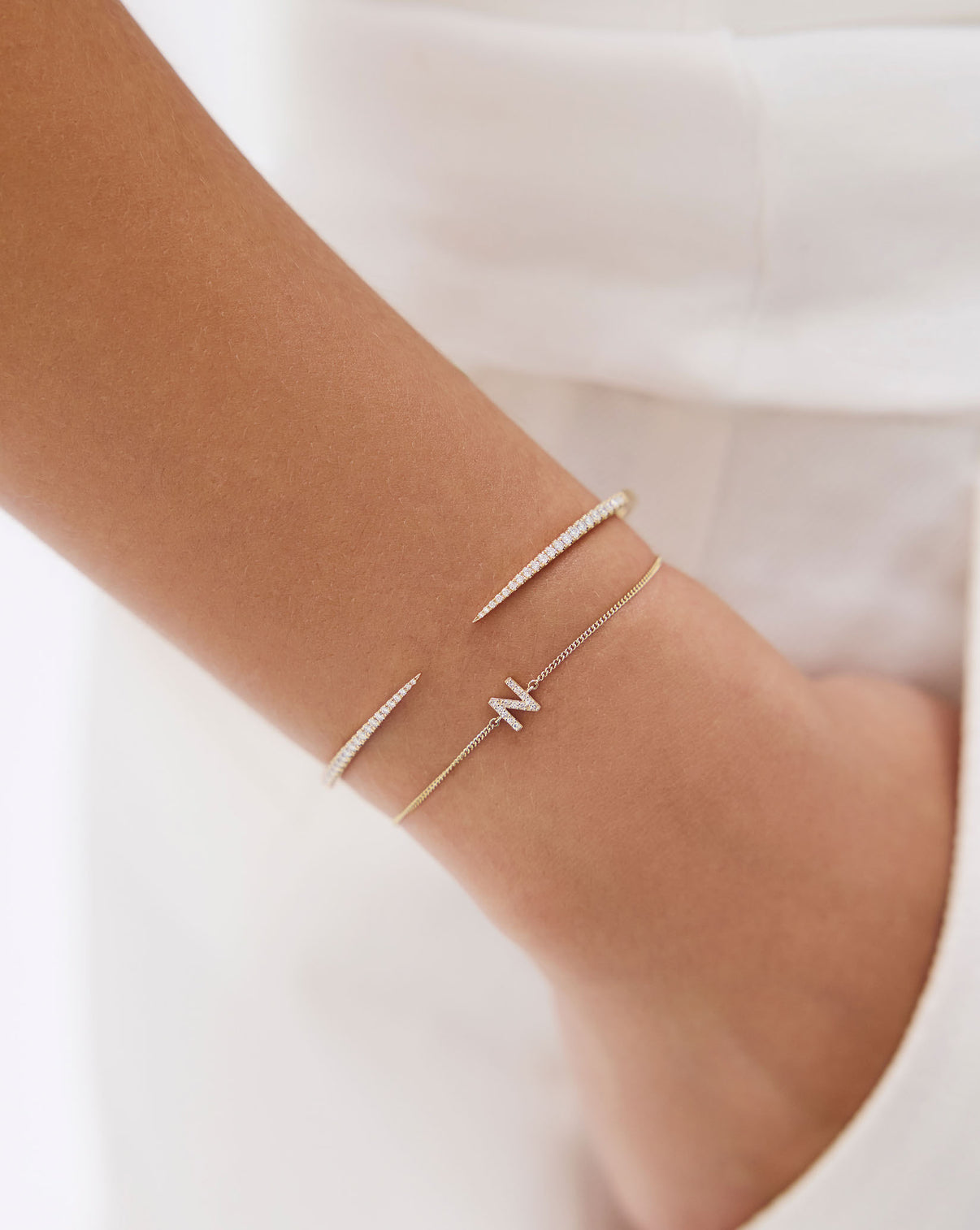 Diamond Claw Cuff displayed on white background highlighting the luxurious gold band and brilliant diamond details