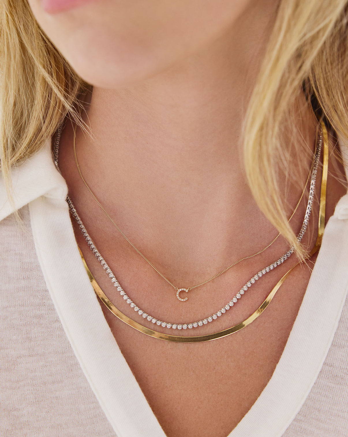 Model wearing Diamond Initial Necklace layered elegantly, showcasing personalized luxury jewelry styling - Ring Concierge