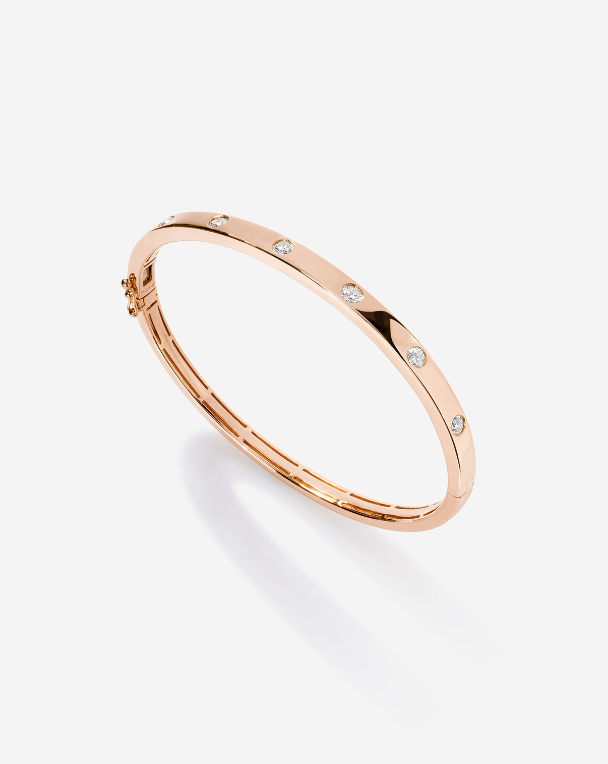 Rose gold Inlay Diamond Bangle photographed at an angle to show the three-dimensional quality and depth of the diamond setting 14k rose gold