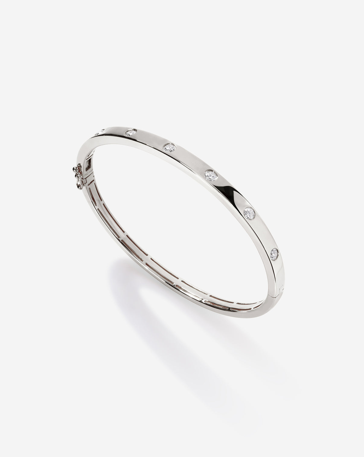Side view of white gold Inlay Diamond Bangle displaying the circular pattern of inlaid diamonds and overall symmetry 14k white gold