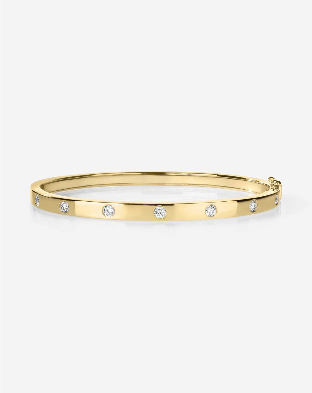 Inlay Diamond Bangle in gold featuring a sleek band with inlaid diamonds creating a continuous sparkle around the circumference 14k yellow gold