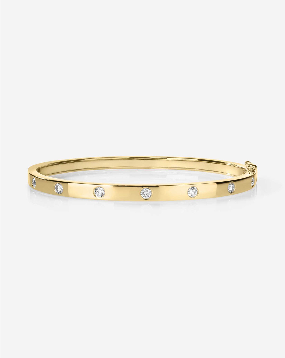 Inlay Diamond Bangle in gold featuring a sleek band with inlaid diamonds creating a continuous sparkle around the circumference 14k yellow gold