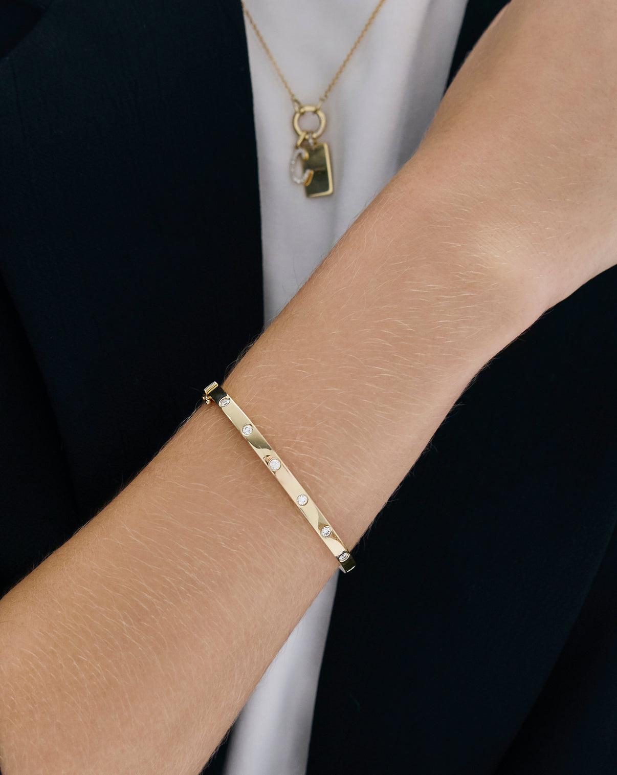 Model's wrist featuring Inlay Diamond Bangle in a lifestyle setting, showing versatility for both casual and formal wear global