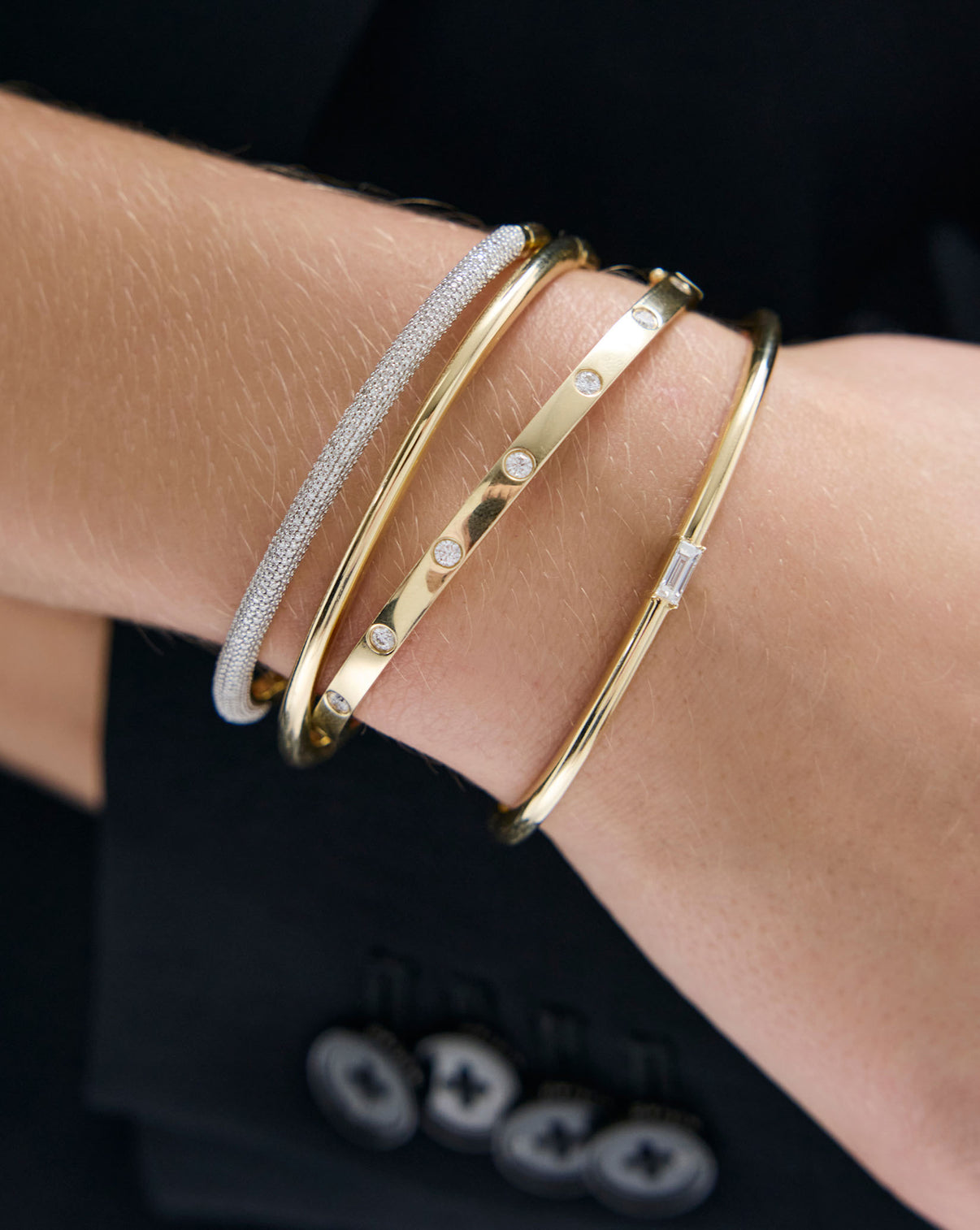 Model wearing Inlay Diamond Bangle with elegant hand positioning to show the bangle's sophisticated appeal global