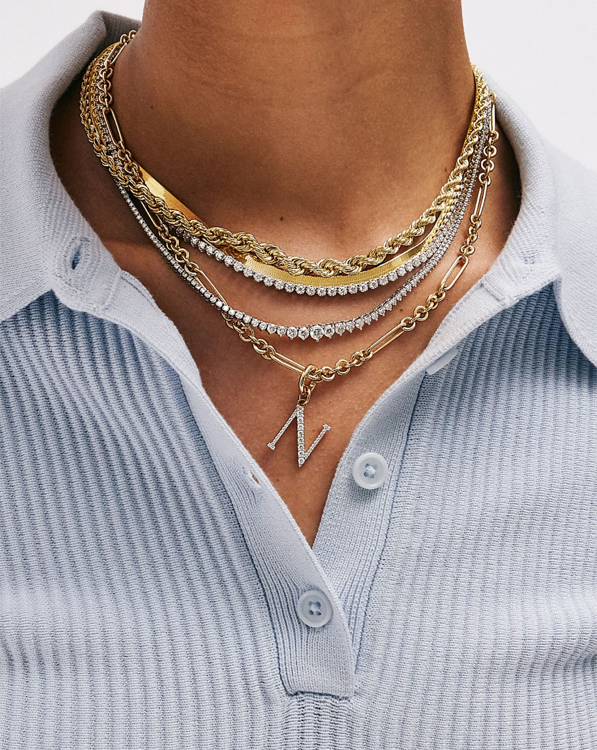 Mixed Link Chain Necklace styled with tennis necklace and gold necklaces on model global