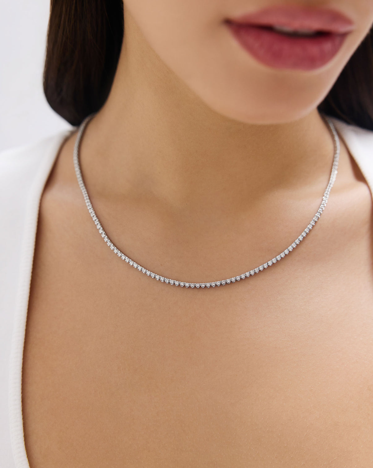 Close-up view of Mini Diamond Tennis Necklace showing the delicate diamond setting and chain detail in 14k white gold GLOBAL