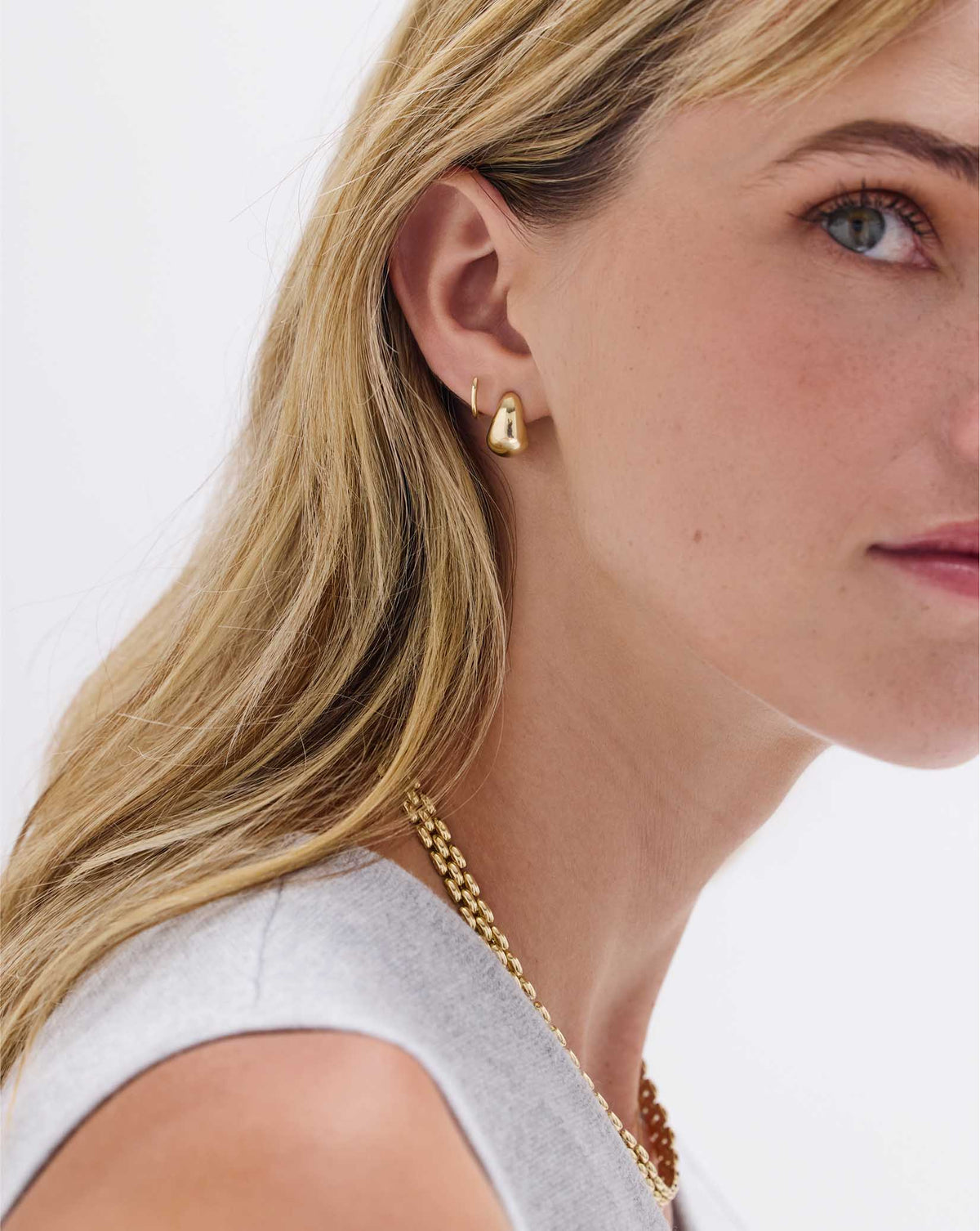 Mini Gold Cloud Earrings in 14k gold worn on model, lifestyle shot showing size and placement