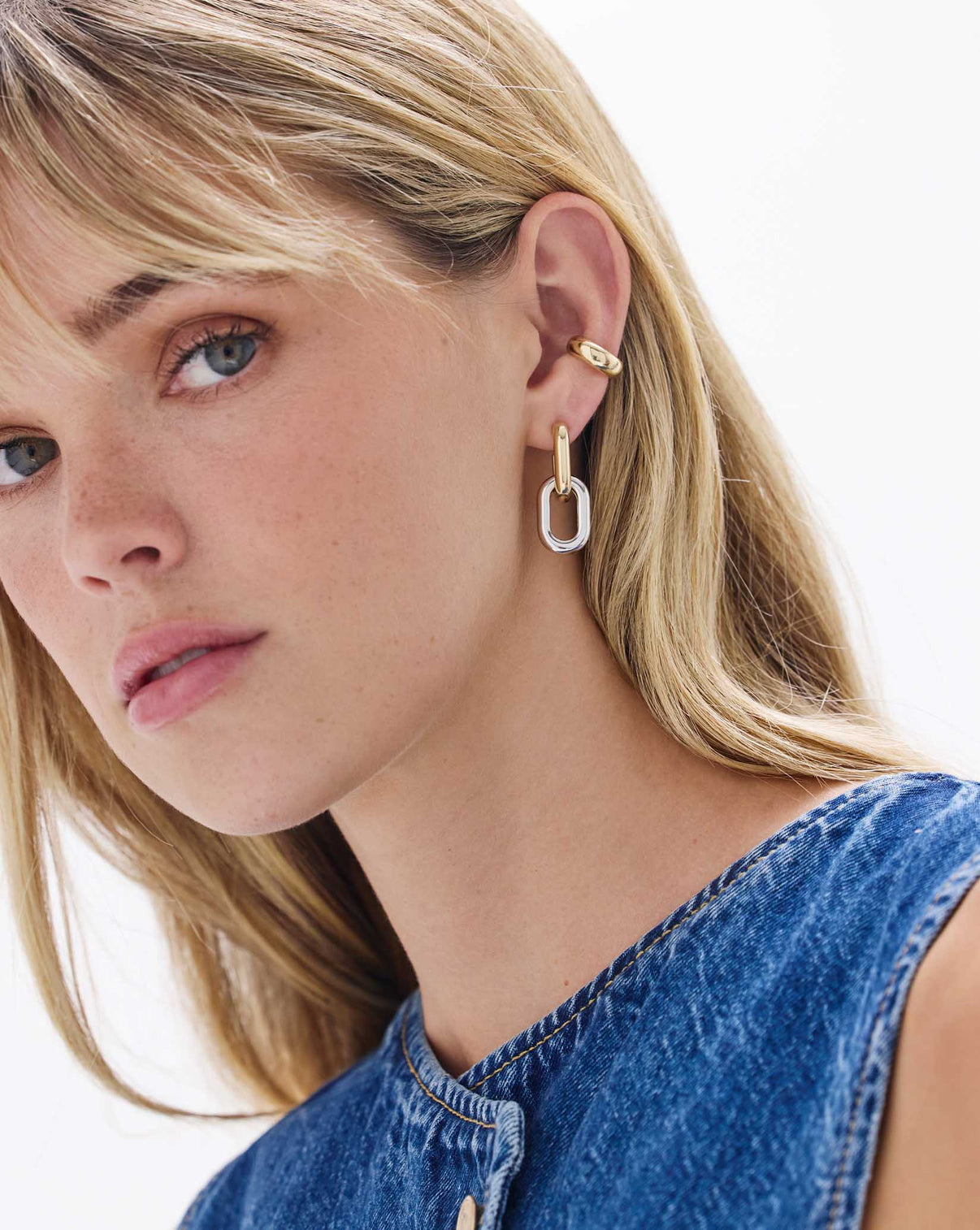 Model wearing Multiway Cloud Link Earrings in 14K Yellow Gold / 14K White Gold and a Gold Cloud Ear Cuff