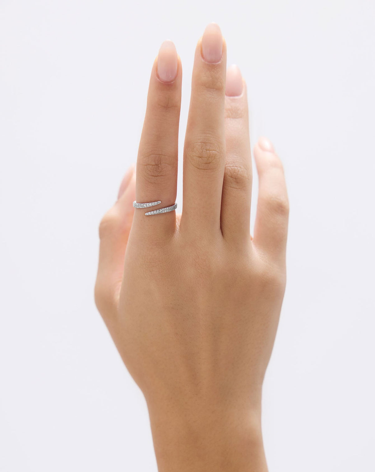 Open Diamond Wrap Ring worn on finger, showcasing how the curved band elegantly wraps around GLOBAL
