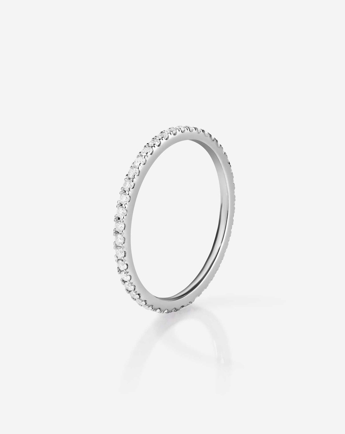 Flat lay of 1.3 mm perfect pave diamond ring in platinum | full diamond coverage - standing