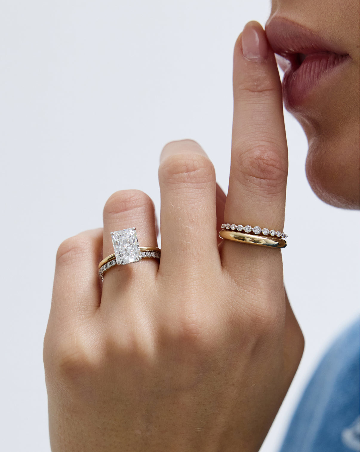 Petite Gold Cloud Ring in 14k yellow gold, worn by model paired with several other rings