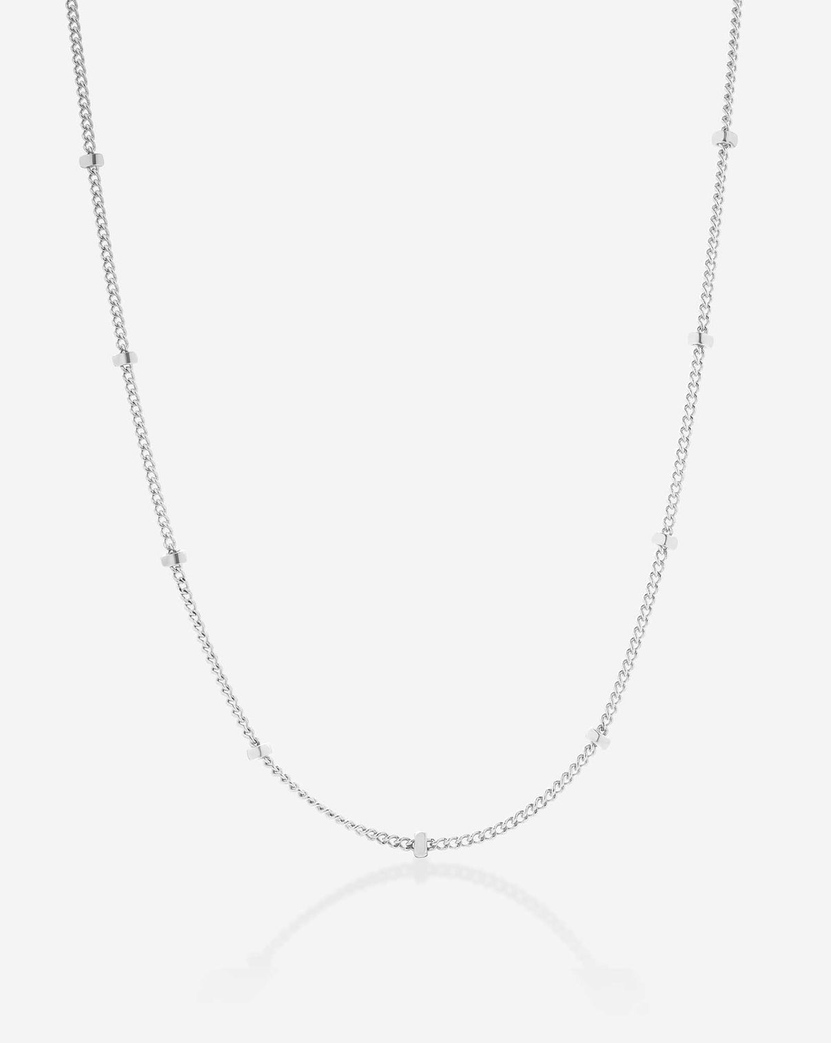Ghost image of chain necklace in white gold