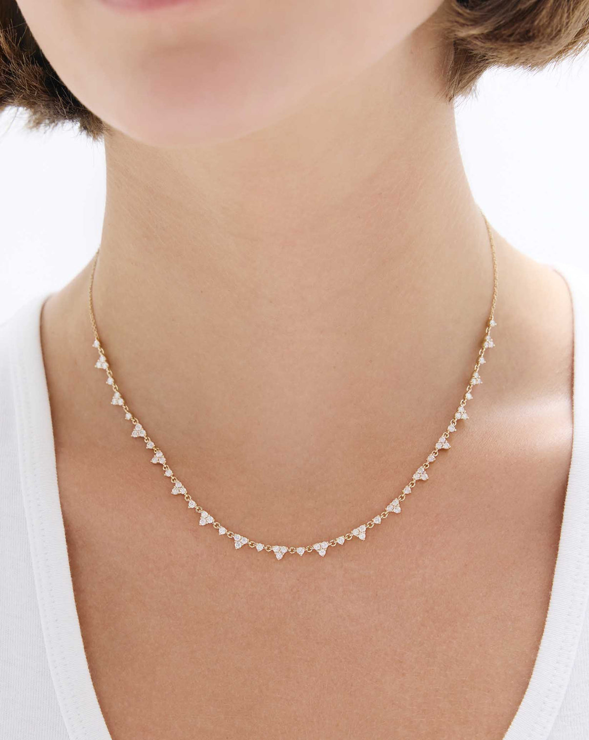 Trio Diamond Layering Necklace in 14k gold worn on model, showing three bezel-set diamonds