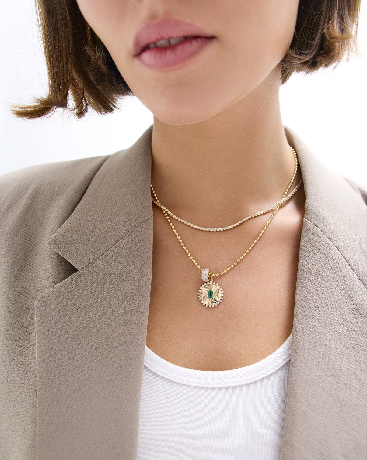 Fluted emerald pendant necklace worn on model showing size and styling