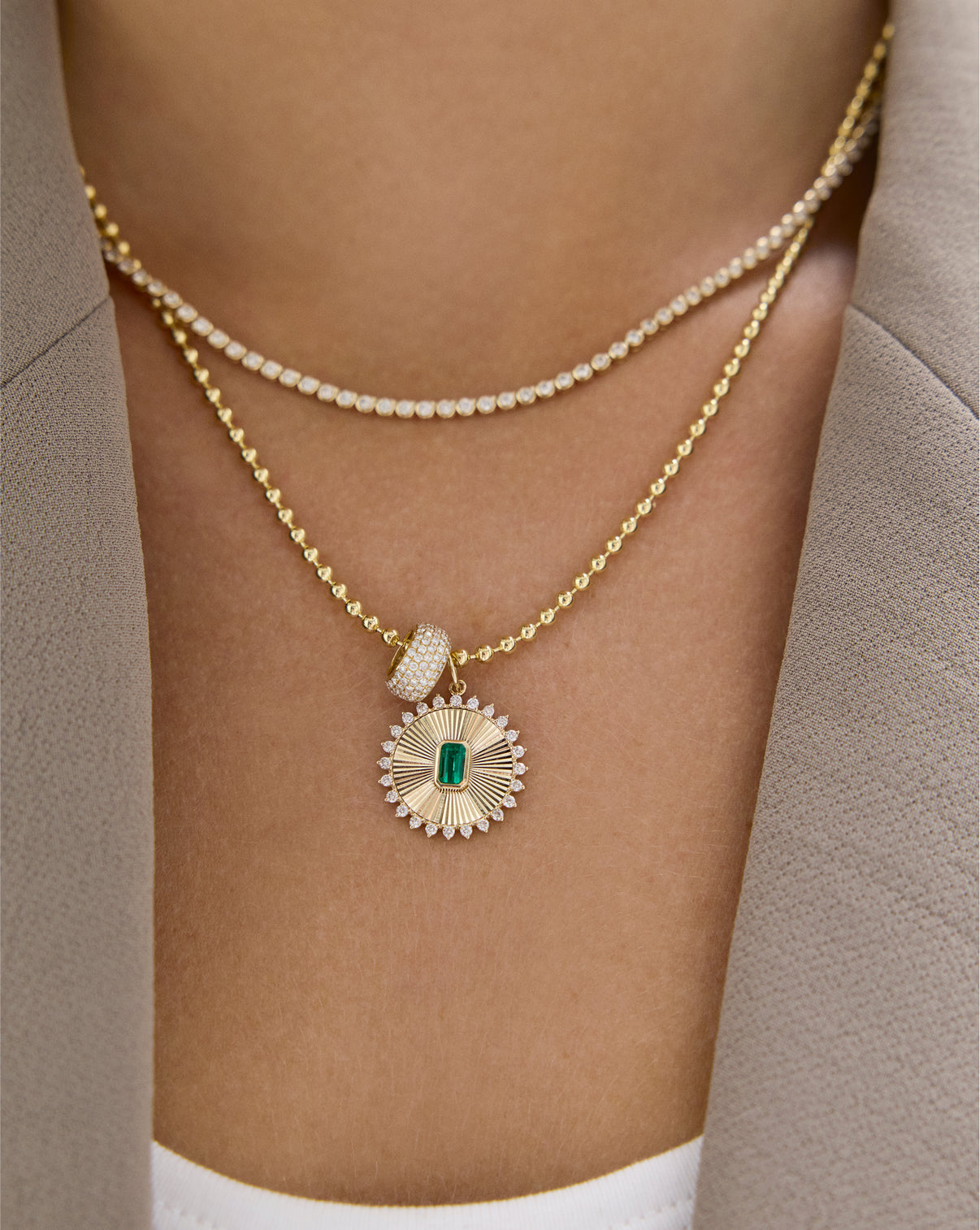 Fluted emerald pendant necklace on model demonstrating proportional size and fit