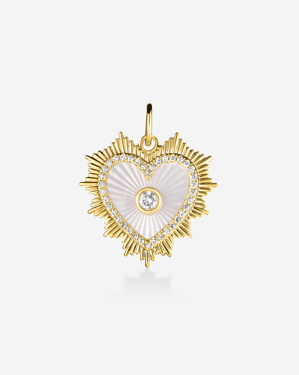 Gold fluted heart pendant with white pearl center on white background