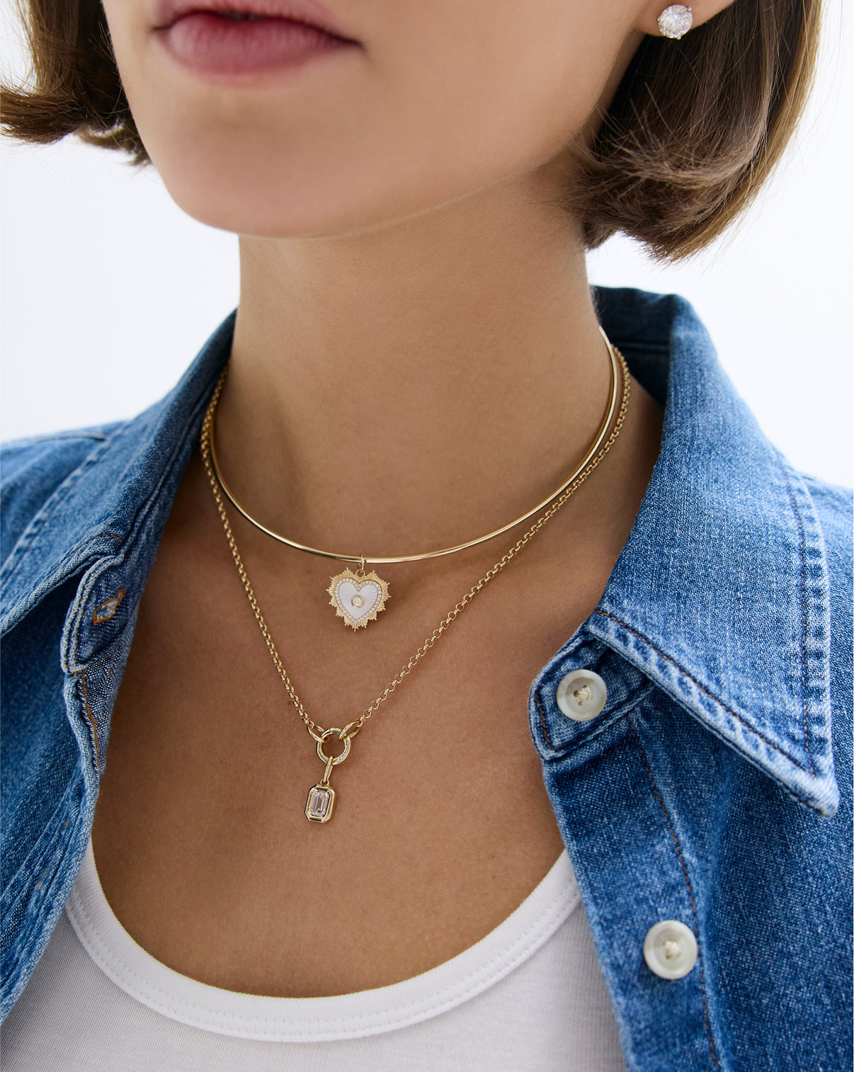 Fluted pearl heart pendant worn on delicate gold chain, lifestyle photography