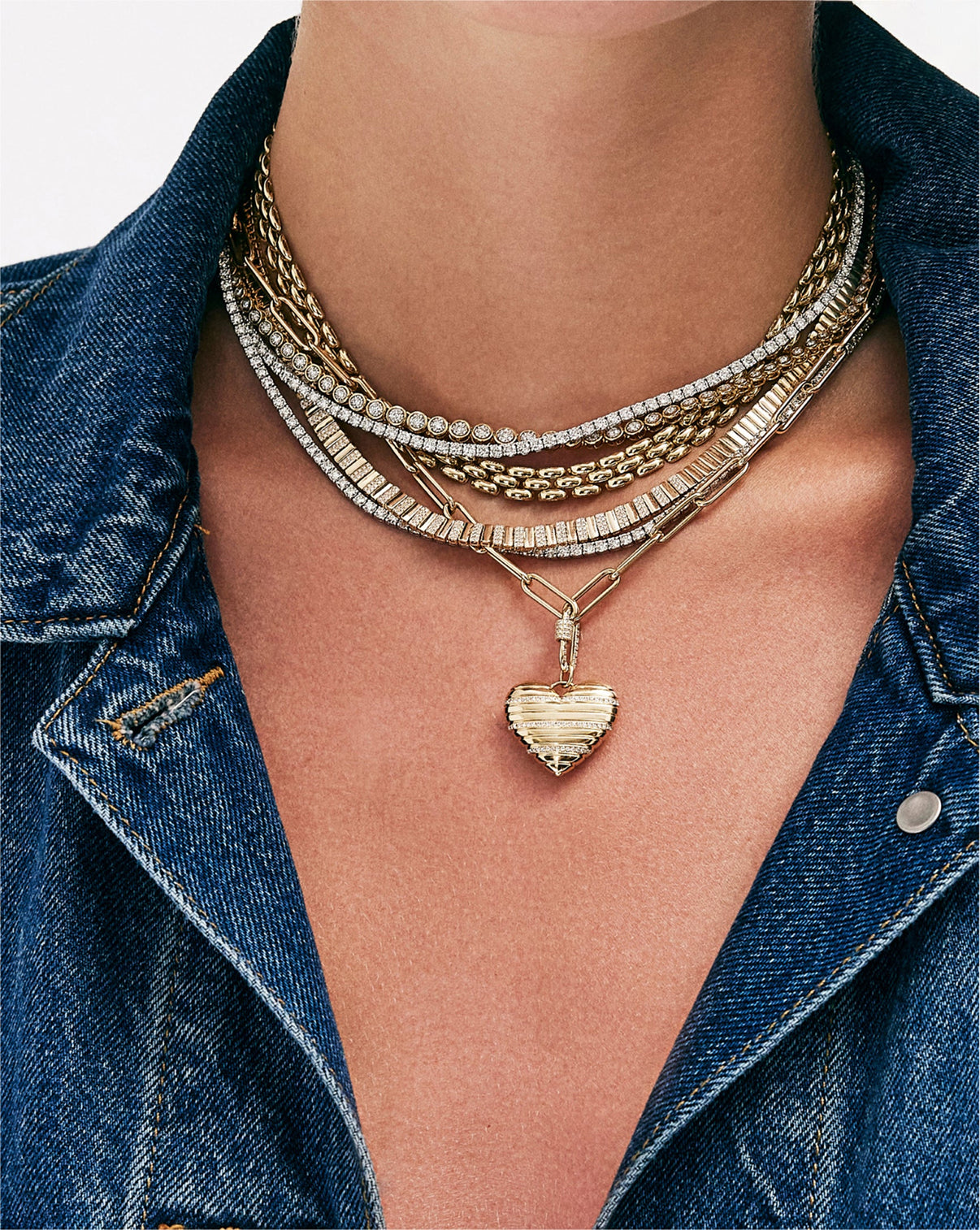 Styling shot of gold split chain necklace with complementary pieces