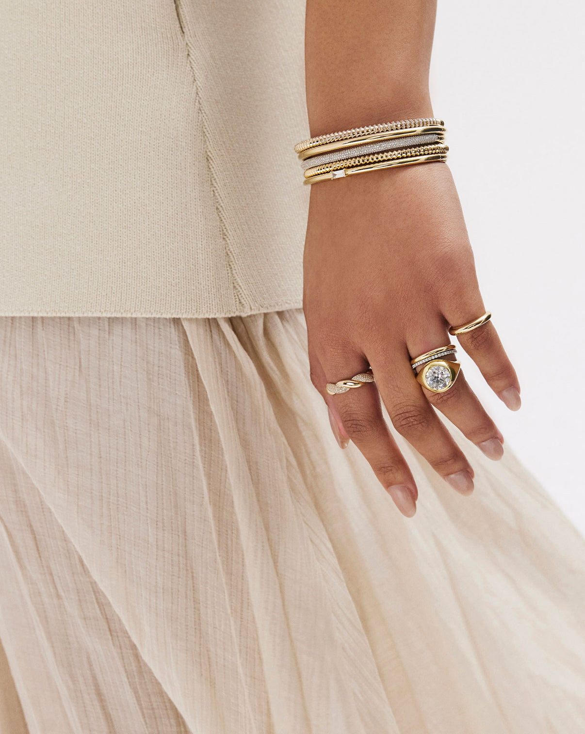 Model's elegant hand featuring the Gold Cloud Ring, highlighting the ring's varying width from 2.8mm to 5.5mm