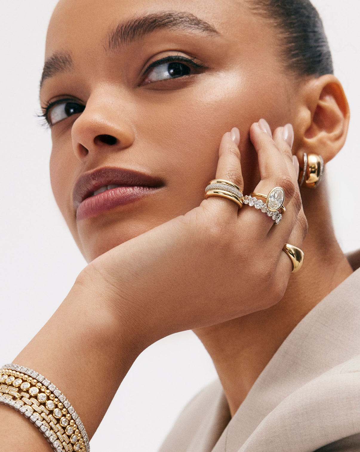 Lifestyle shot of model wearing the signature Gold Cloud Ring with its distinctive organic silhouette