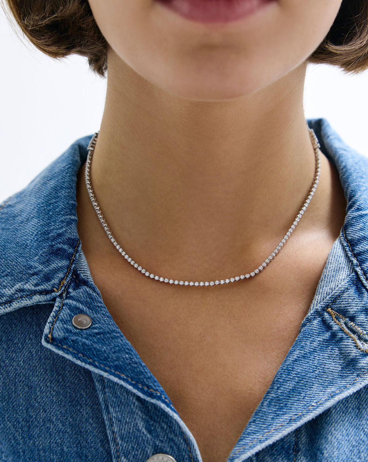 2-in-1 Diamond Tennis Necklace + Bracelet as a necklace on model with denim jacket global