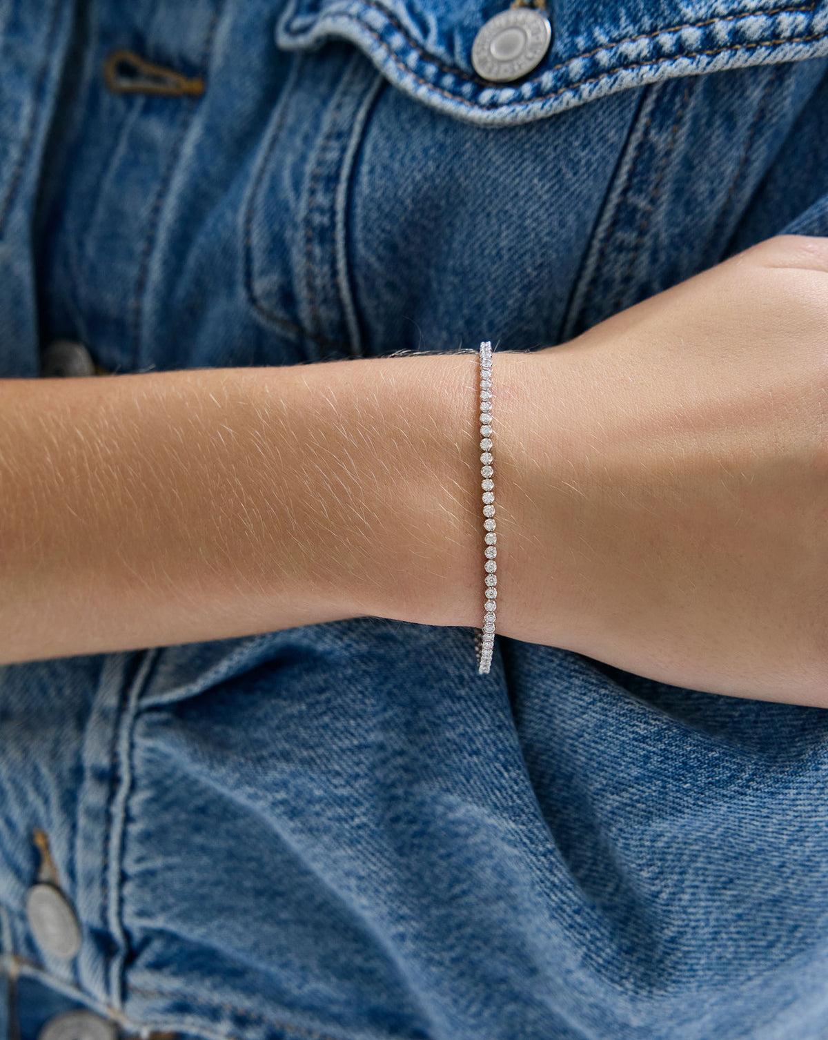 2-in-1 Diamond Tennis Necklace + Bracelet as a bracelet on model with denim jacket global
