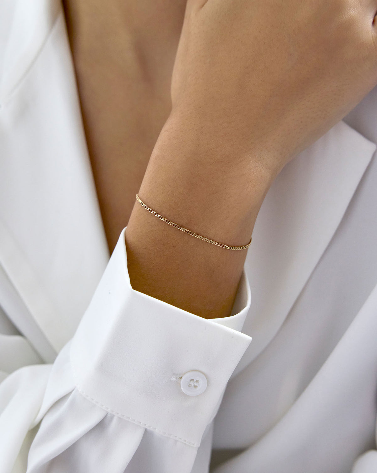 Diamond Cut Curb Chain Bracelet shown on model's wrist