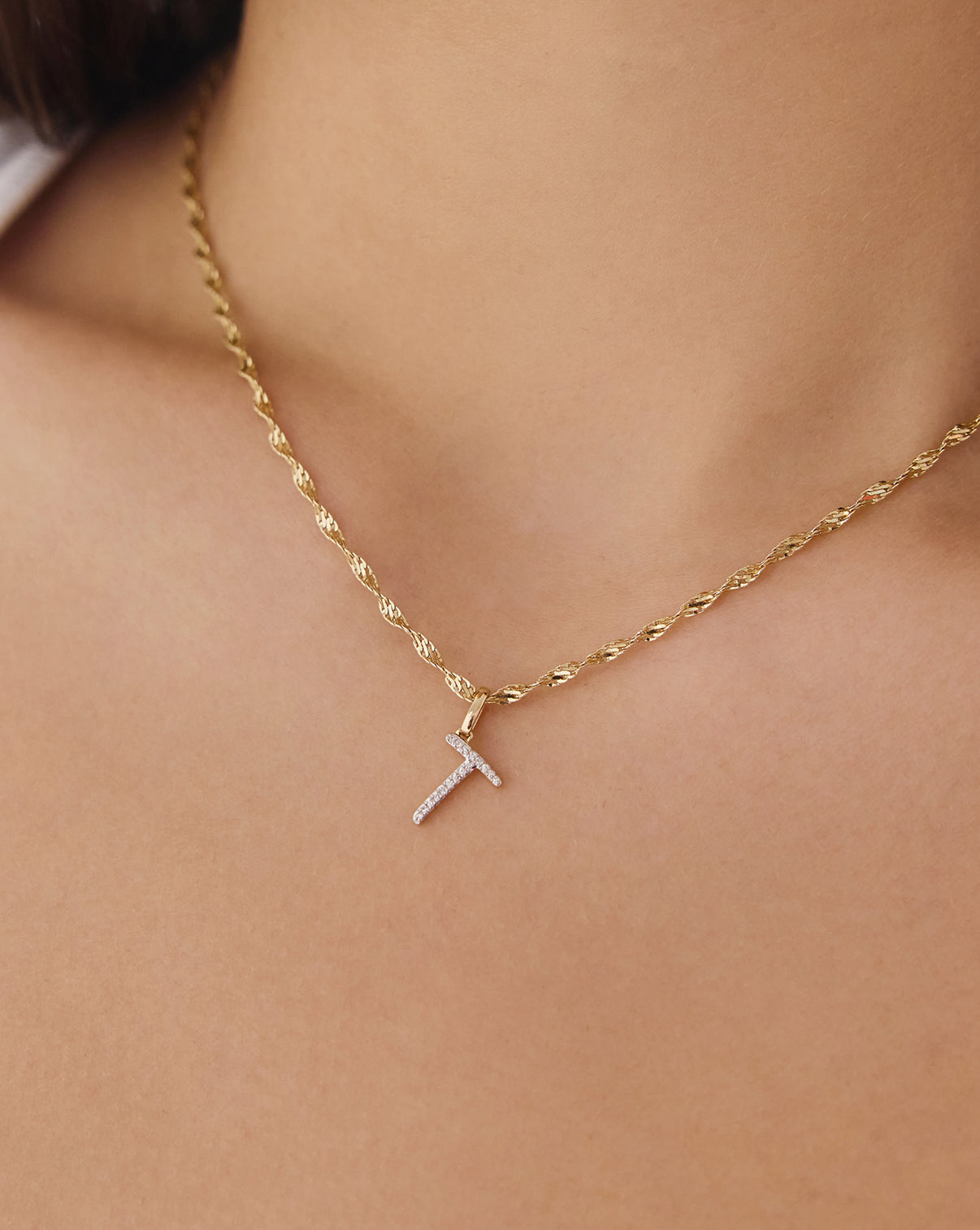 on-model image of T diamond script initial pendant global