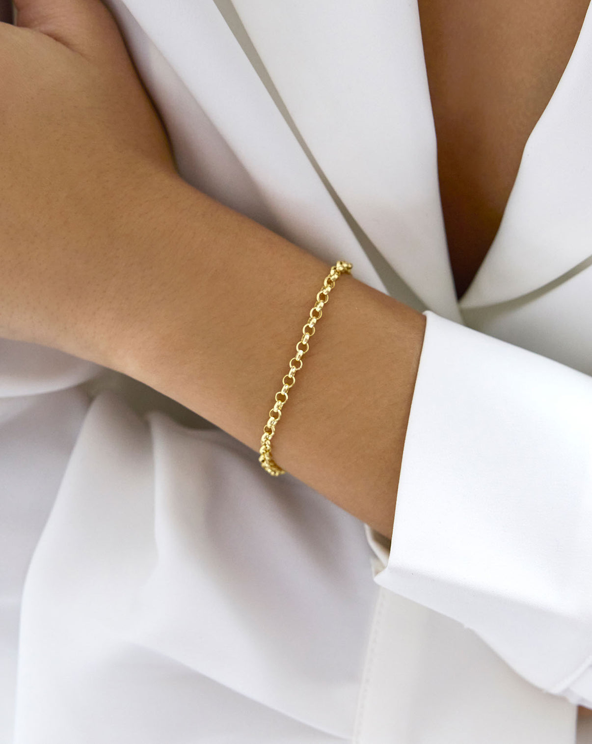 Yellow Gold Hollow Rolo Chain Bracelet shown on model's wrist