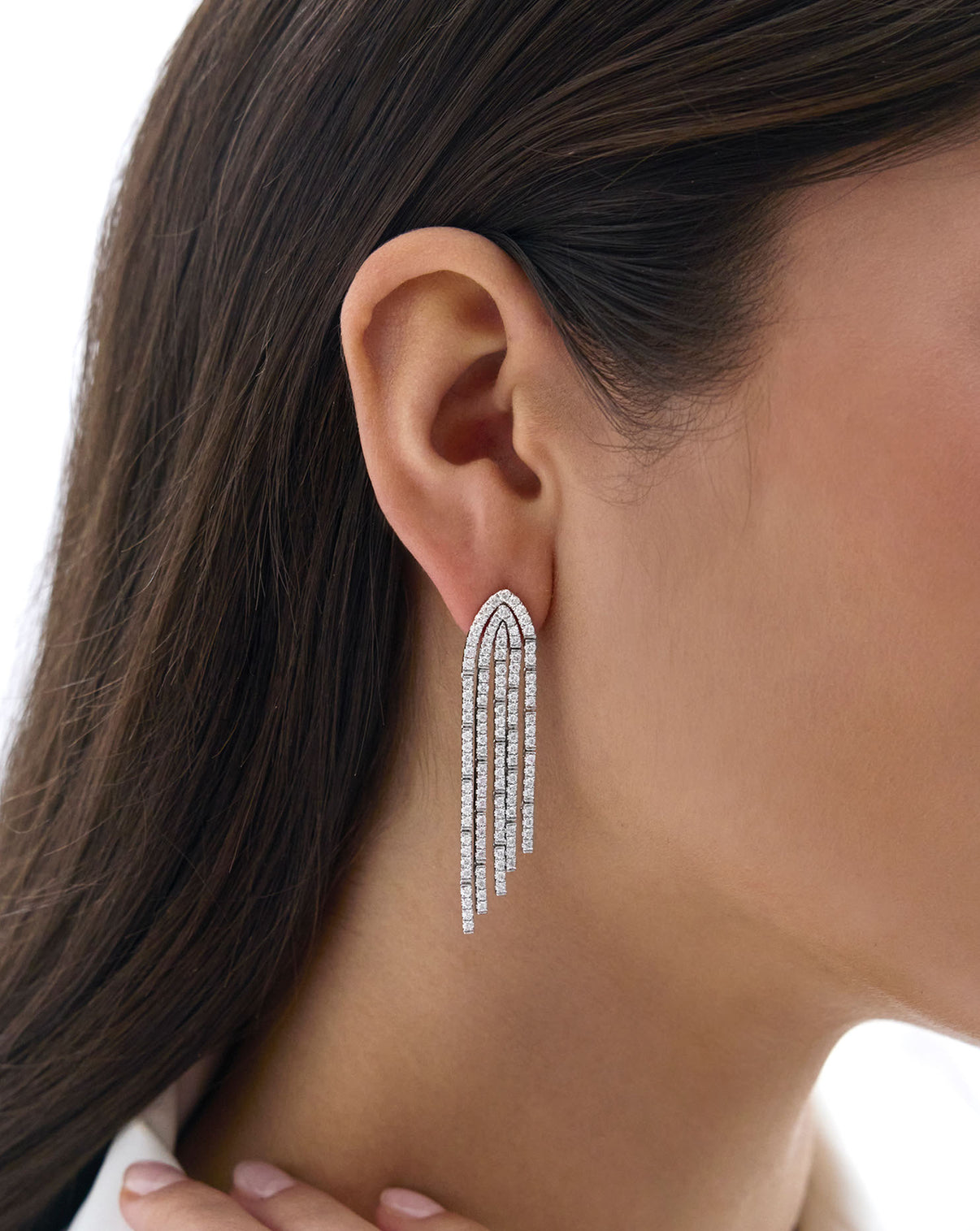 close up of Pavé Waterfall Earrings on model