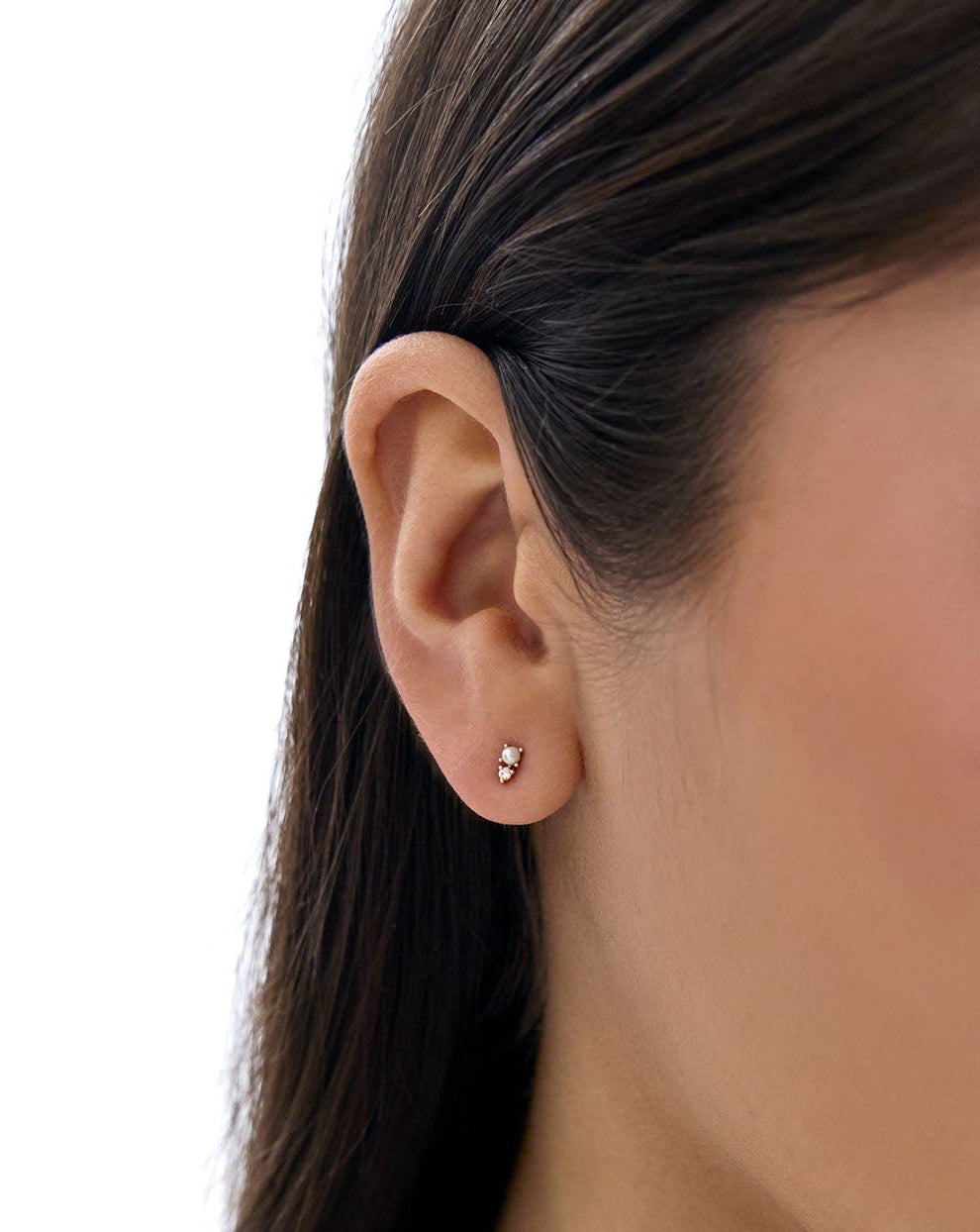 Close up of model's ear wearing the Pearl and Diamond Studs