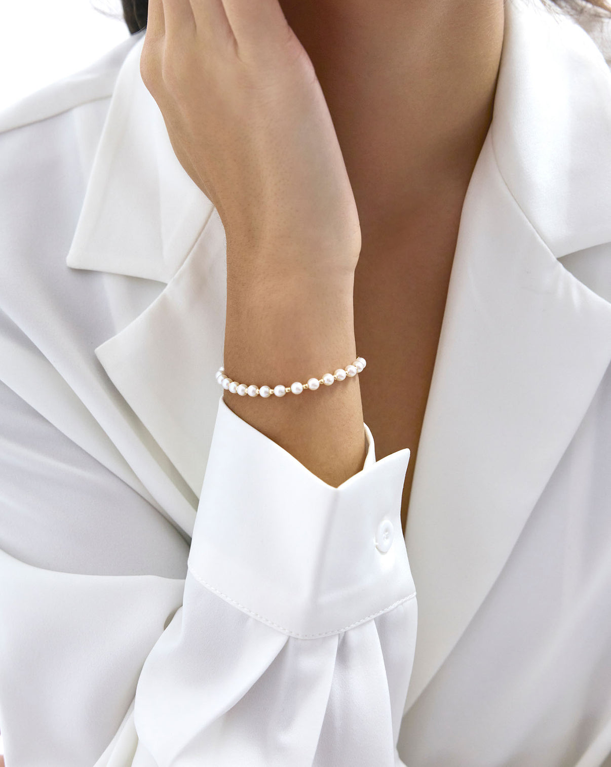 Pearl Station Bracelet worn on wrist, demonstrating the elegant drape and fit
