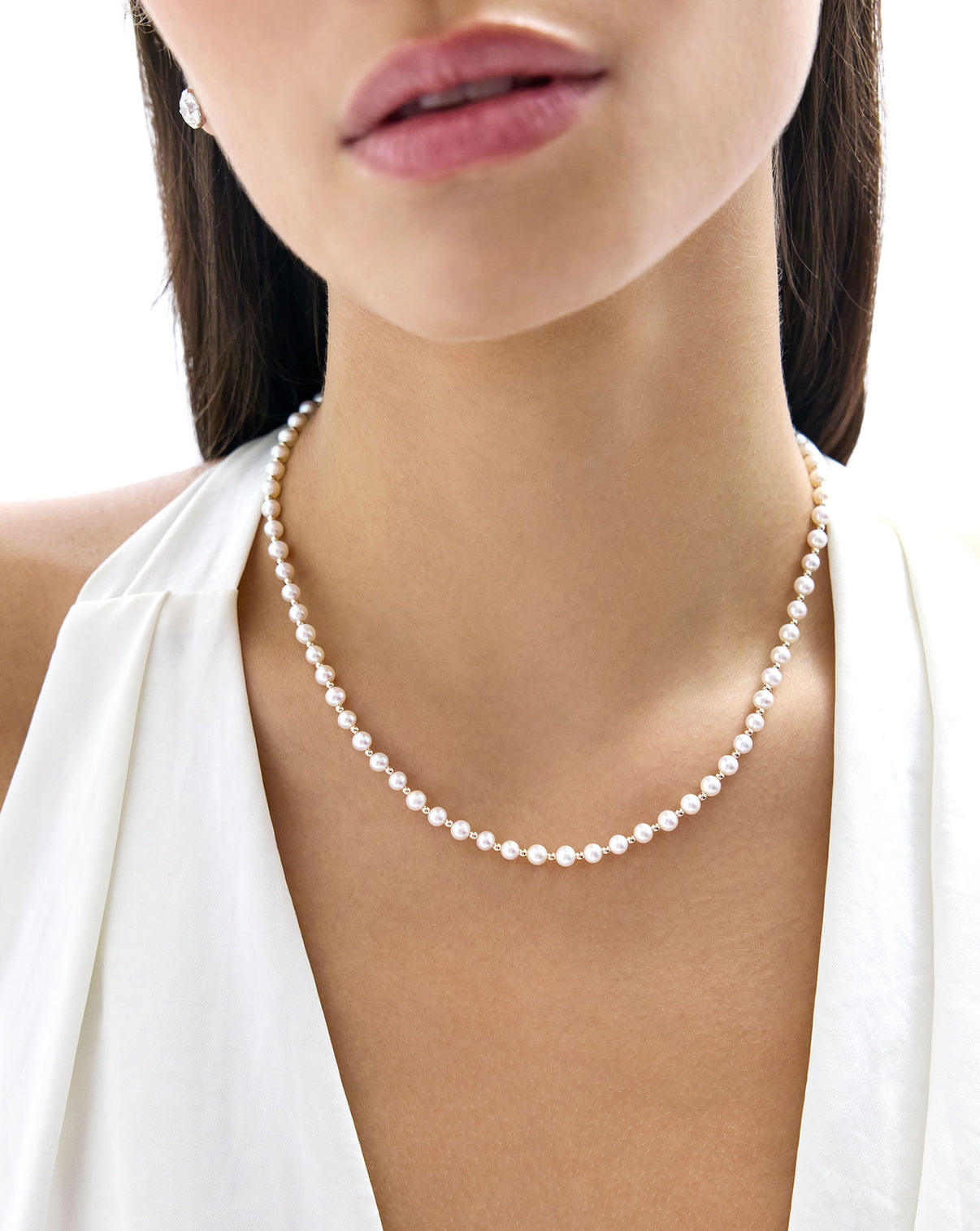Close-up of Pearl Station Necklace showing the elegant spacing of pearls along the gold chain