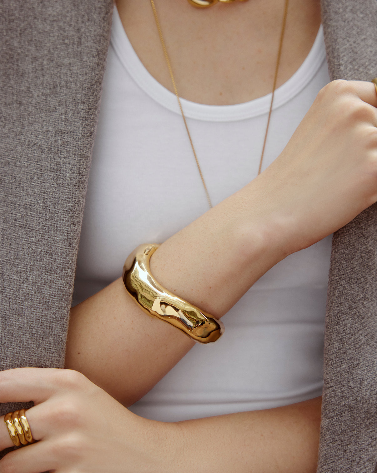 Melted Bangle worn on wrist, demonstrating the comfortable fit and elegant proportions