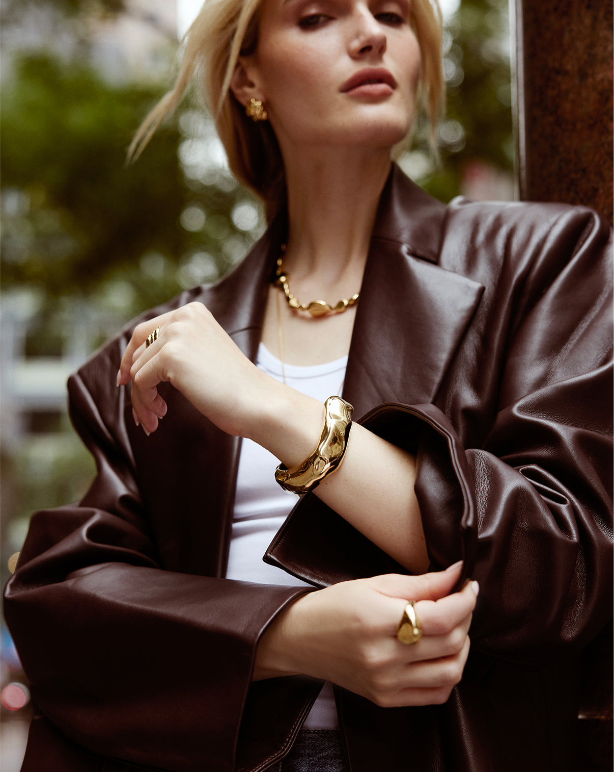 Ring Concierge Model wearing Melted Bangle side profile view highlighting the dimensional, flowing design elements