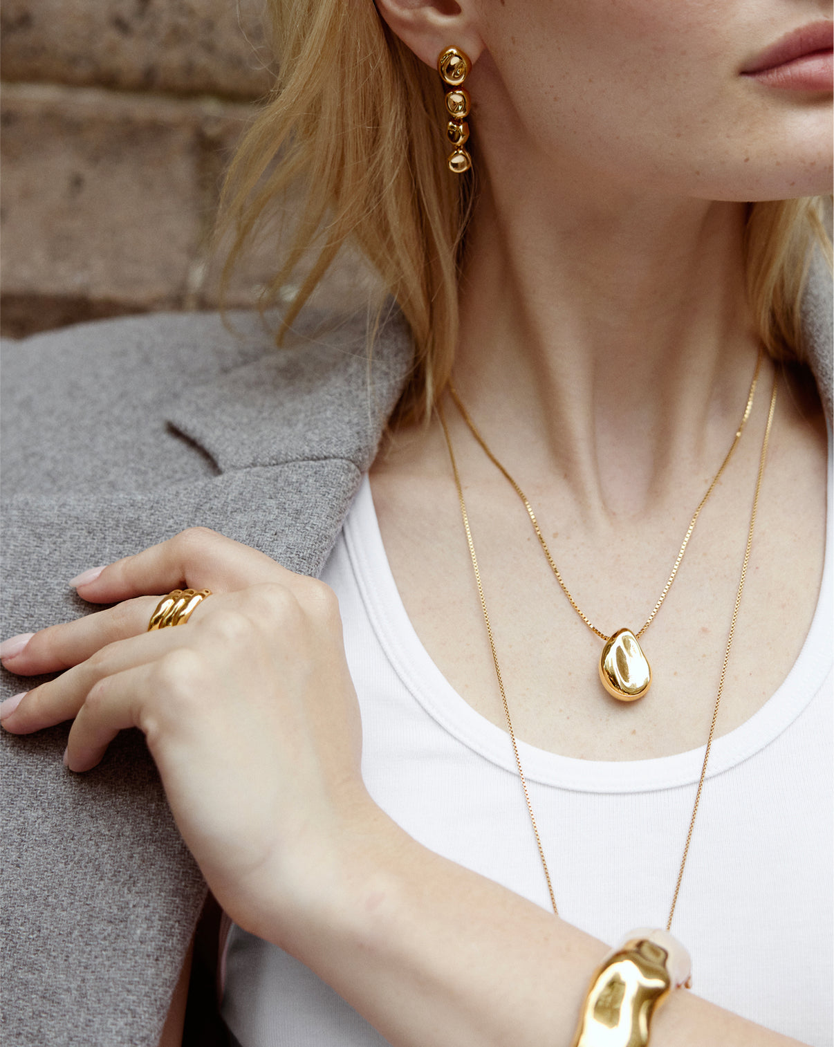 Forma Melted Pendant Necklace worn by model, showcasing how the geometric pendant sits elegantly on the neckline